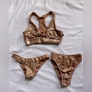Cleo the Hurricane Polewear. Rose gold bra, high rise panty and scanty pants